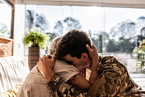 solider hugging a parent or elder